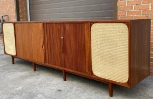 Mid Century Modern Teak Stereo Console with Tambour Doors will house the equipment students will use in class