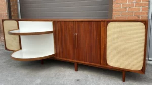 Mid Century Modern Teak Stereo Console with Tambour Doors will house the equipment students will use in class